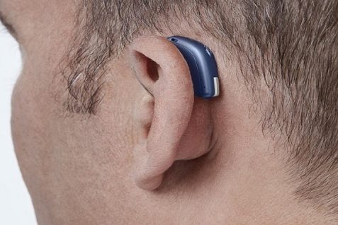 Modern digital in the ear hearing aid for deafness and the hard of hearing in man's ear.