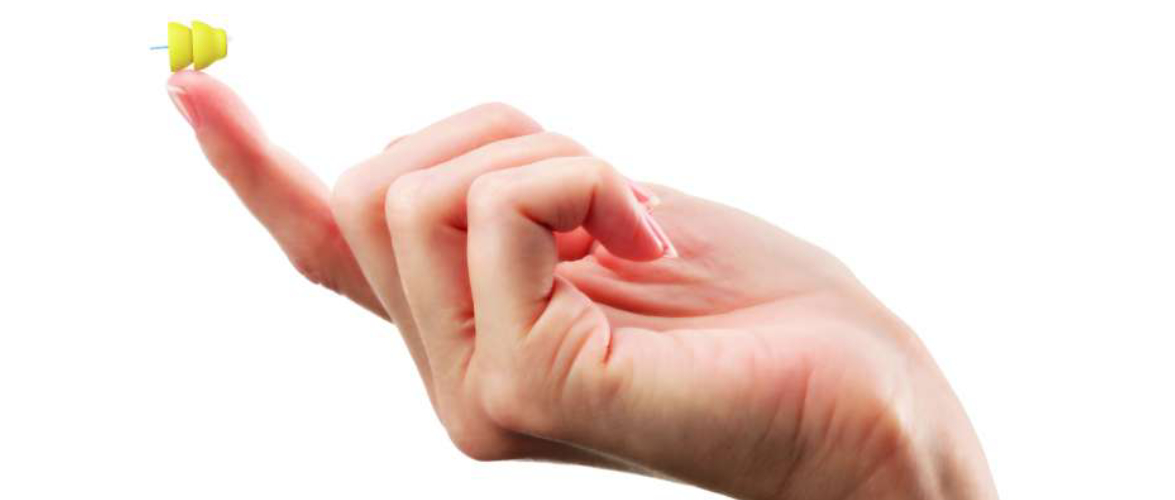 A Woman Hand Holding An Invisible Hearing Aid.