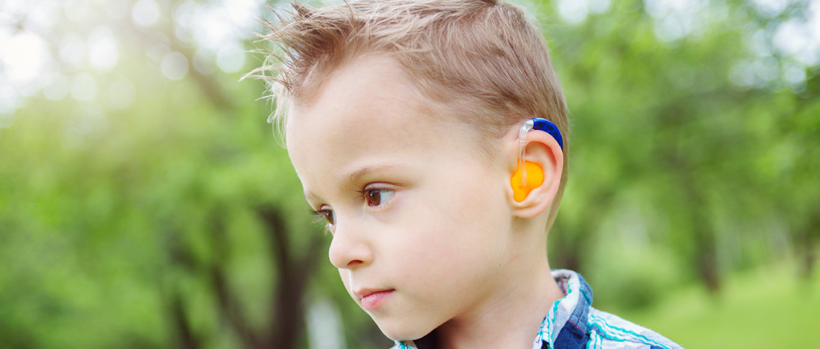 A Portrait of Little Boy Wearing Hearing Aid.