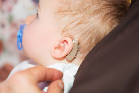 A Little Kid Wearing Hearing Aid.