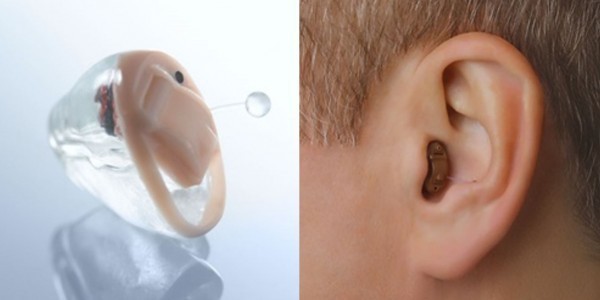 Skin Colored Invisible Hearing Aid On Display.